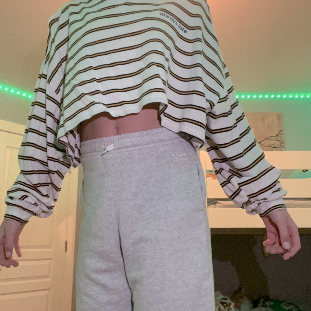 This is a cropped oversized Forever 21 shirt that says “always late” on it.